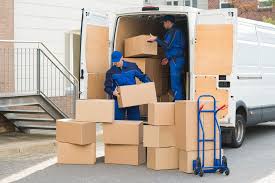 Gulf Mover Bahrain Team Unloading Boxes From Minibus